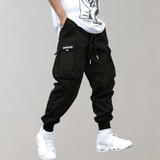 Tomáš – Muške Cargo Jogging Hlače – Ljubičaste Streetwear Hlače s Džepovima na Zip i Riblji Rep