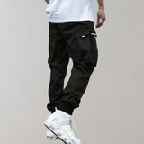 Tomáš – Muške Cargo Jogging Hlače – Ljubičaste Streetwear Hlače s Džepovima na Zip i Riblji Rep
