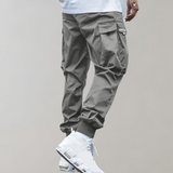 Tomáš – Muške Cargo Jogging Hlače – Ljubičaste Streetwear Hlače s Džepovima na Zip i Riblji Rep