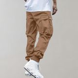 Tomáš – Muške Cargo Jogging Hlače – Ljubičaste Streetwear Hlače s Džepovima na Zip i Riblji Rep